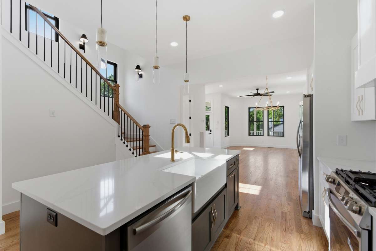 The kitchen flows naturally into the living area, keeping you connected to the rest of the home while you cook.
