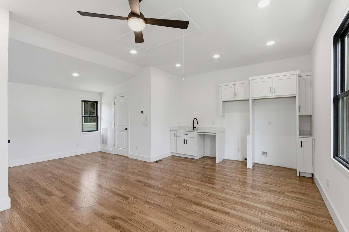 Upstairs, this versatile space includes a full kitchen.