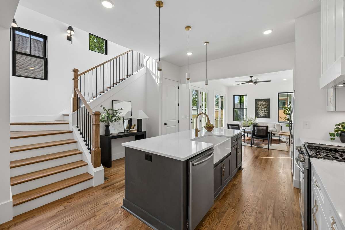The open floor plan allows guests to flow easily between the kitchen, living, and dining areas.