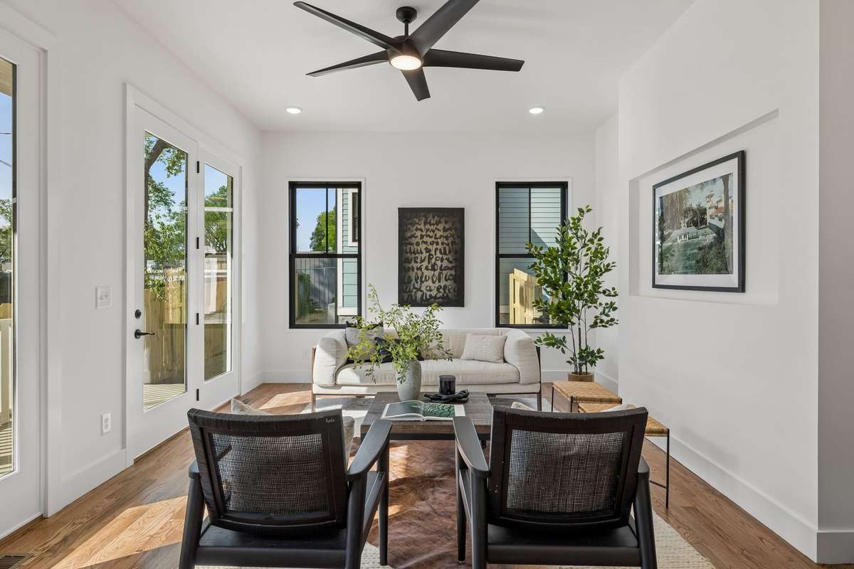Glass doors and tall windows fill the living room with natural light!
