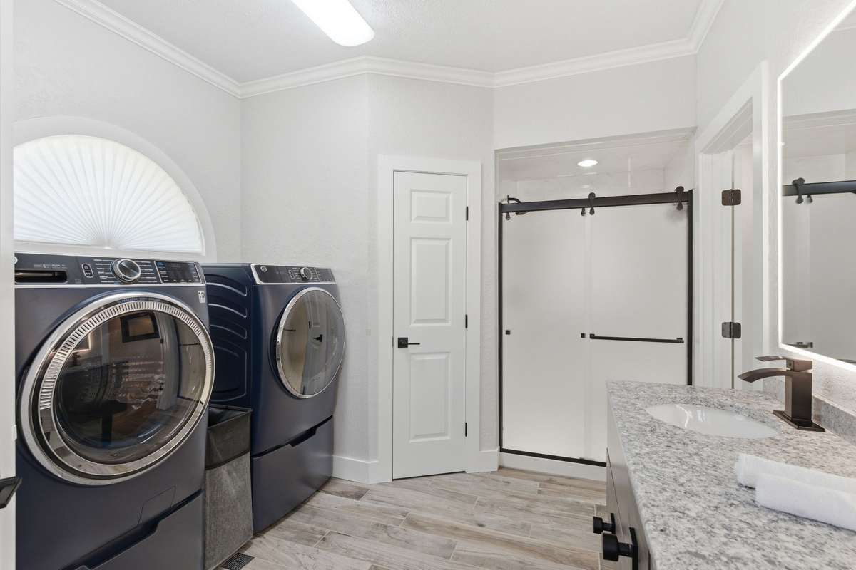The convenience of washer and dryer in the master suite!  Plumbing is there if a standing tub is desired as a future project!