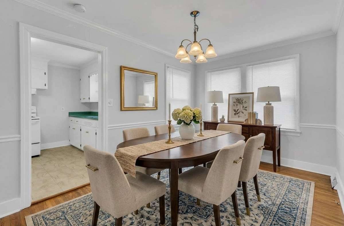 Dining room is Virtually Staged to show sizing and space