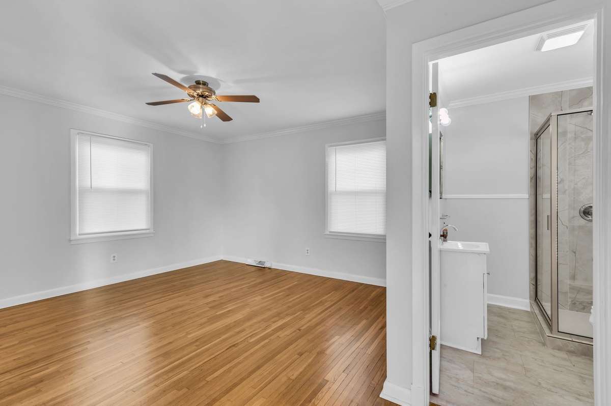 Master or guest bedroom with on suite full bath with new shower and floor