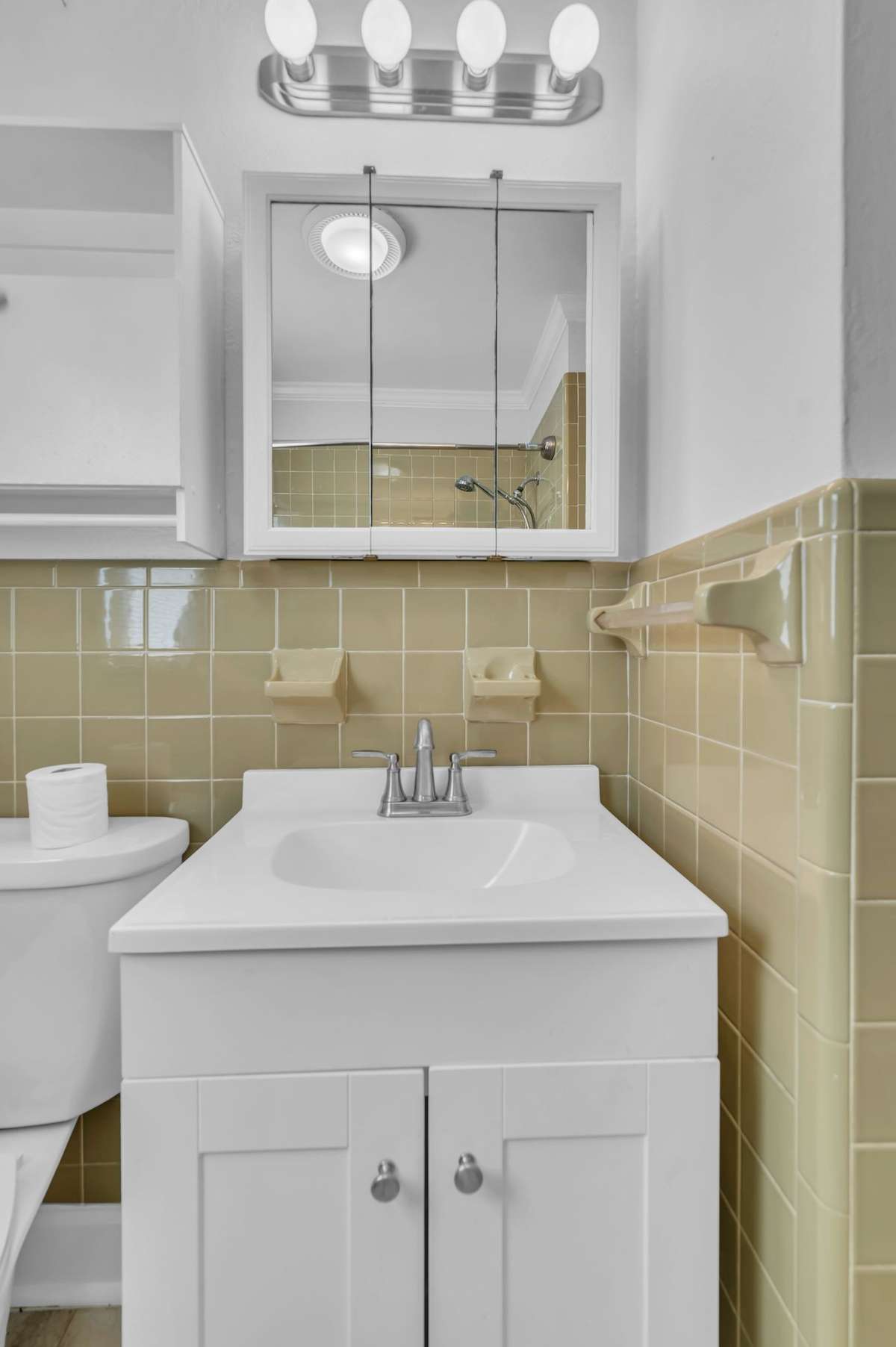 Hall bath with new floor, tub/shower and taller height vanity