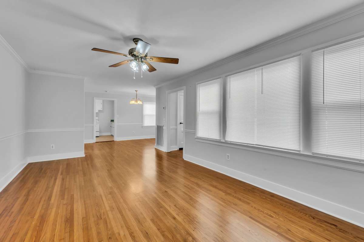 Front living room with tons of natural light and open to the dining room