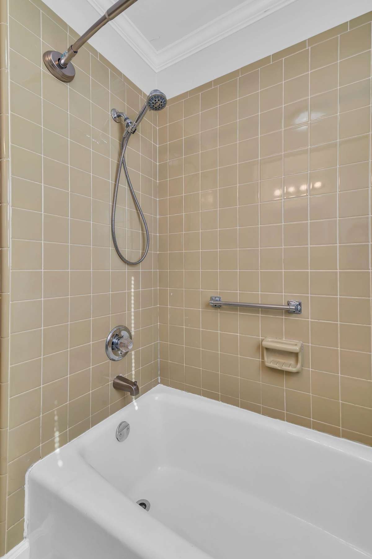Nice neutral tile surround above the tub and new floors
