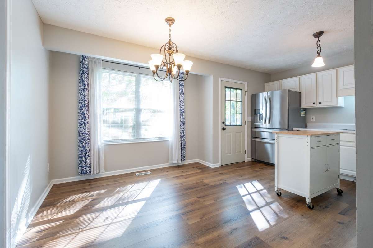 This eat-in kitchen comes with all the appliances, as well as a portable island for added storage and workspace.