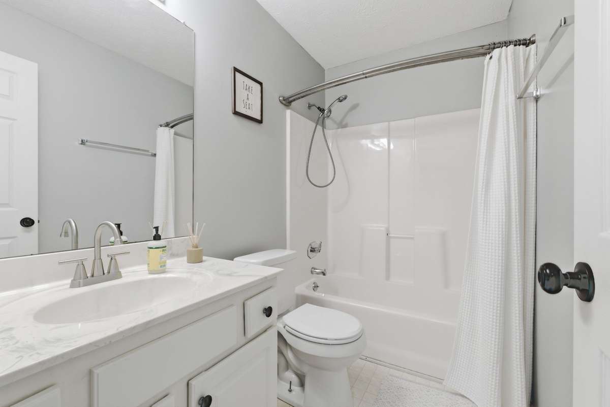 Spotless bathroom with new sink fixtures.