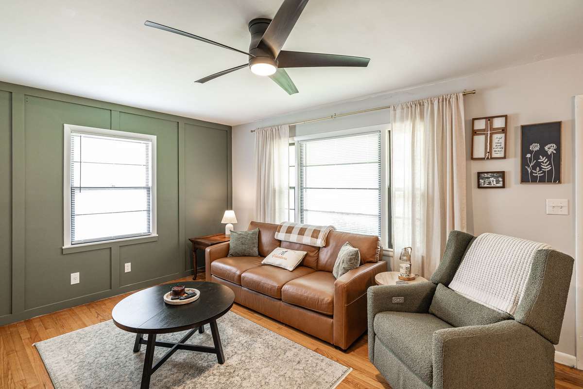 Large living room with feature wall is open to kitchen~