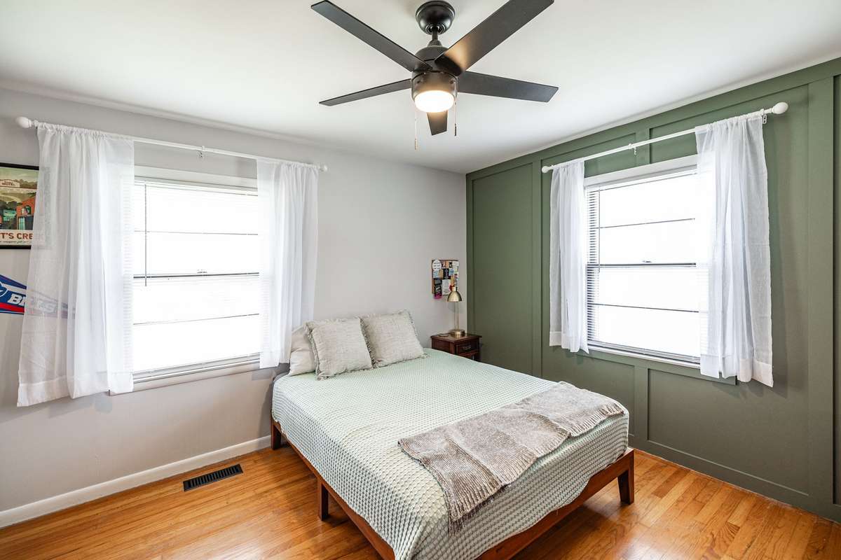 bedroom #2, original hardwood flooring &n feature wall~