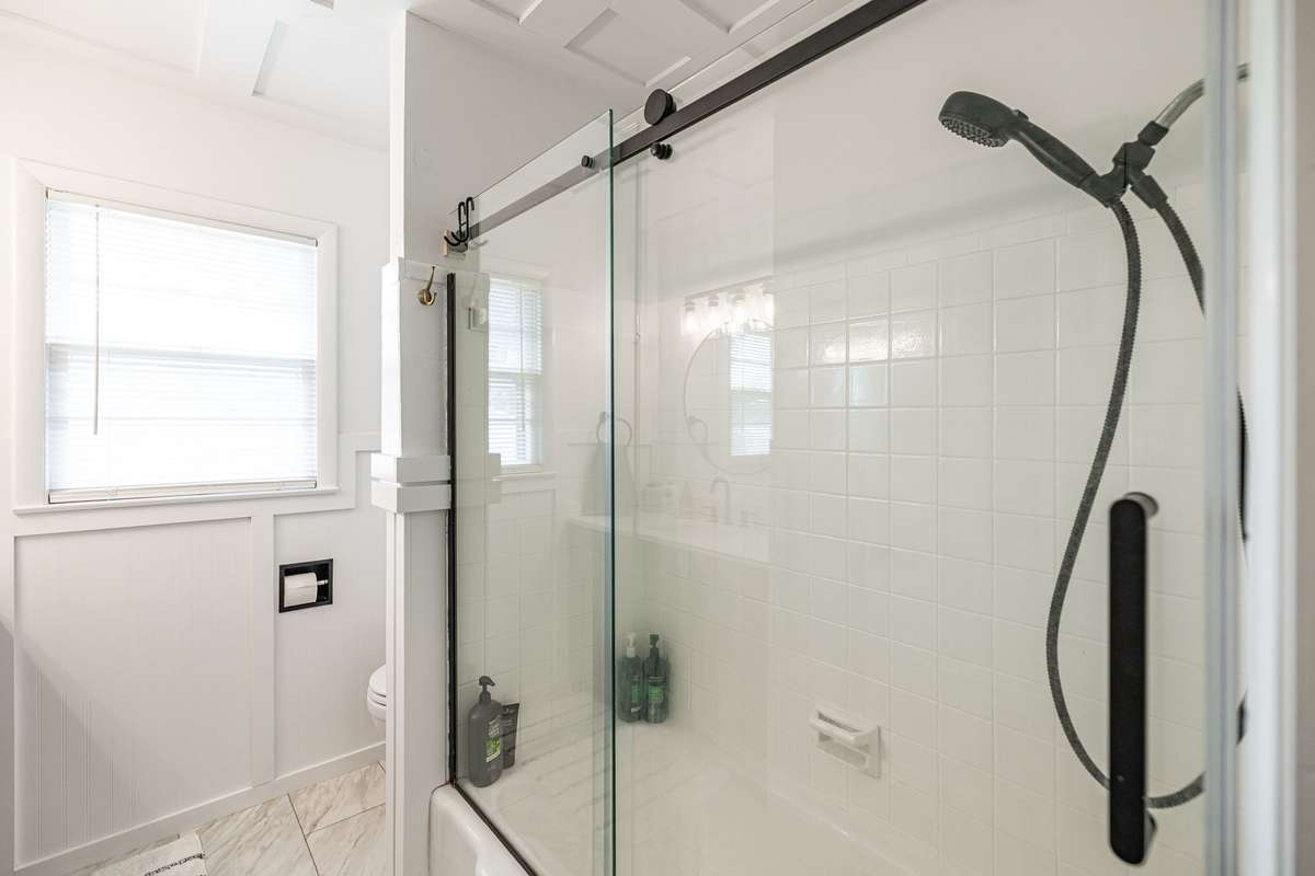 glass shower door and updated fixtures