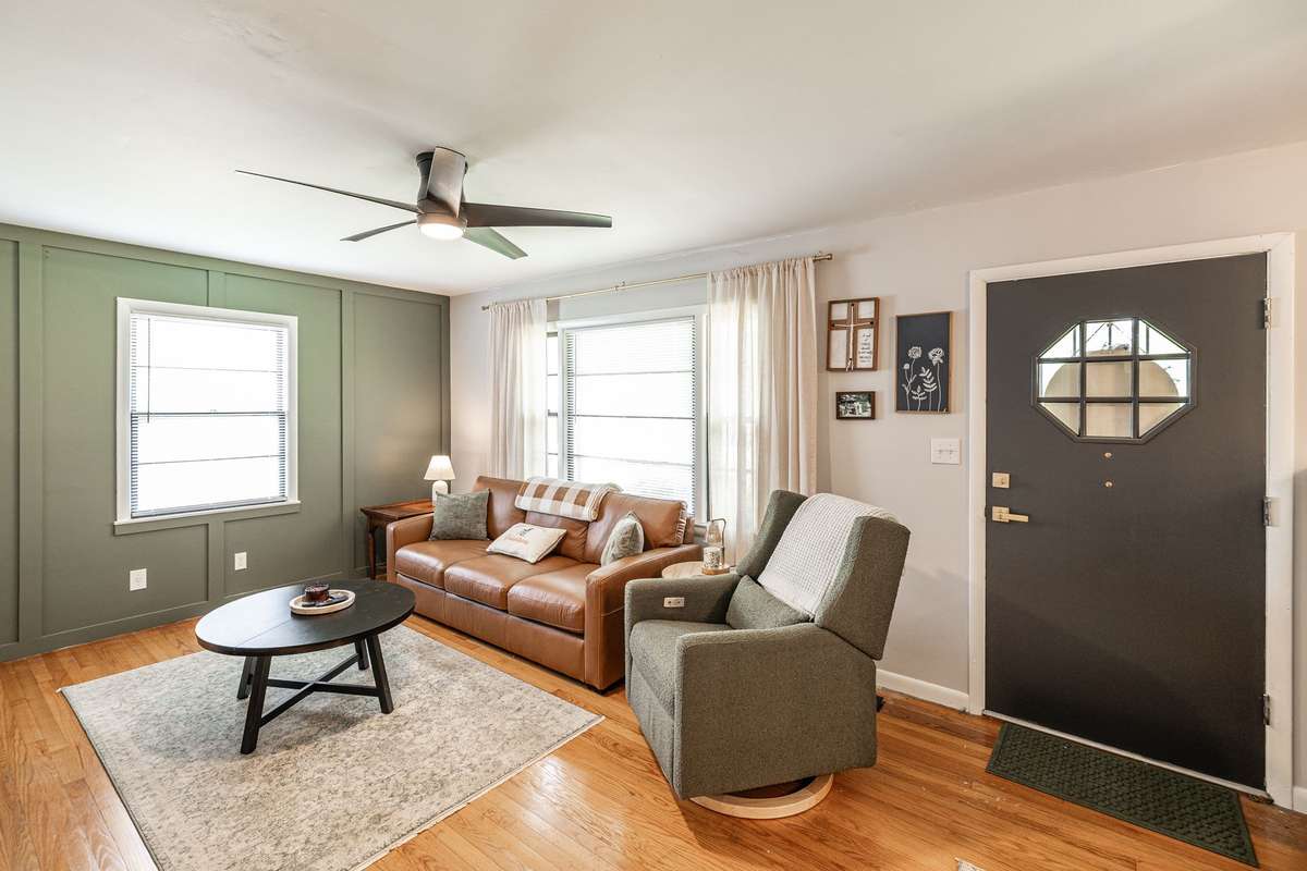 Original hardwood flooring in living room, new paint throughout~