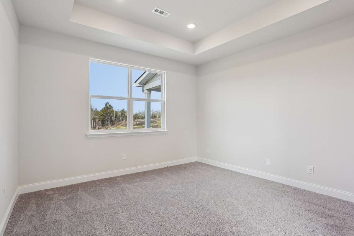 A tray ceiling with LED lighting was added to the Owner's Bedroom as an additional design element.