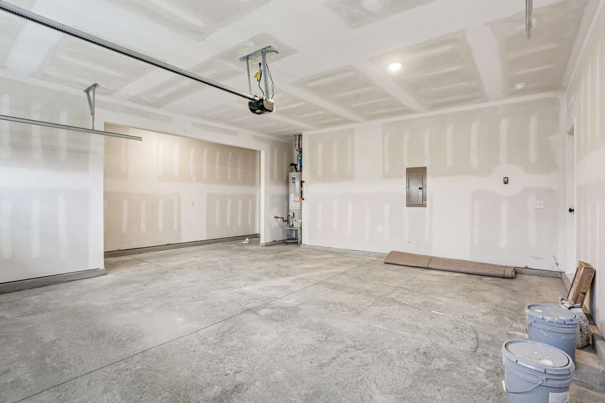 The garage includes an additional 1/2 stall that is meant for added storage or could also be used for a work space.