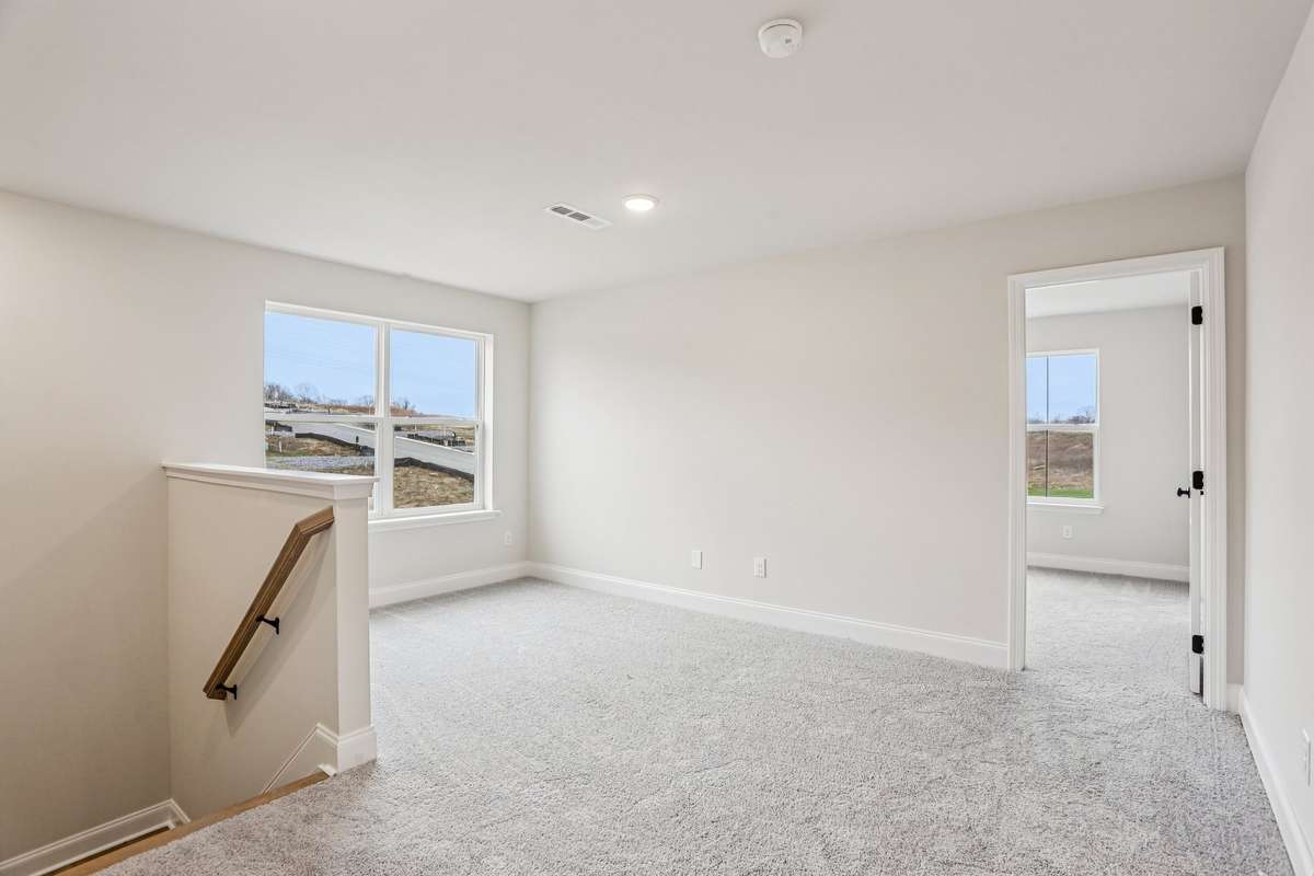 This home features an included loft—perfect for a game room, playroom, or additional living space.