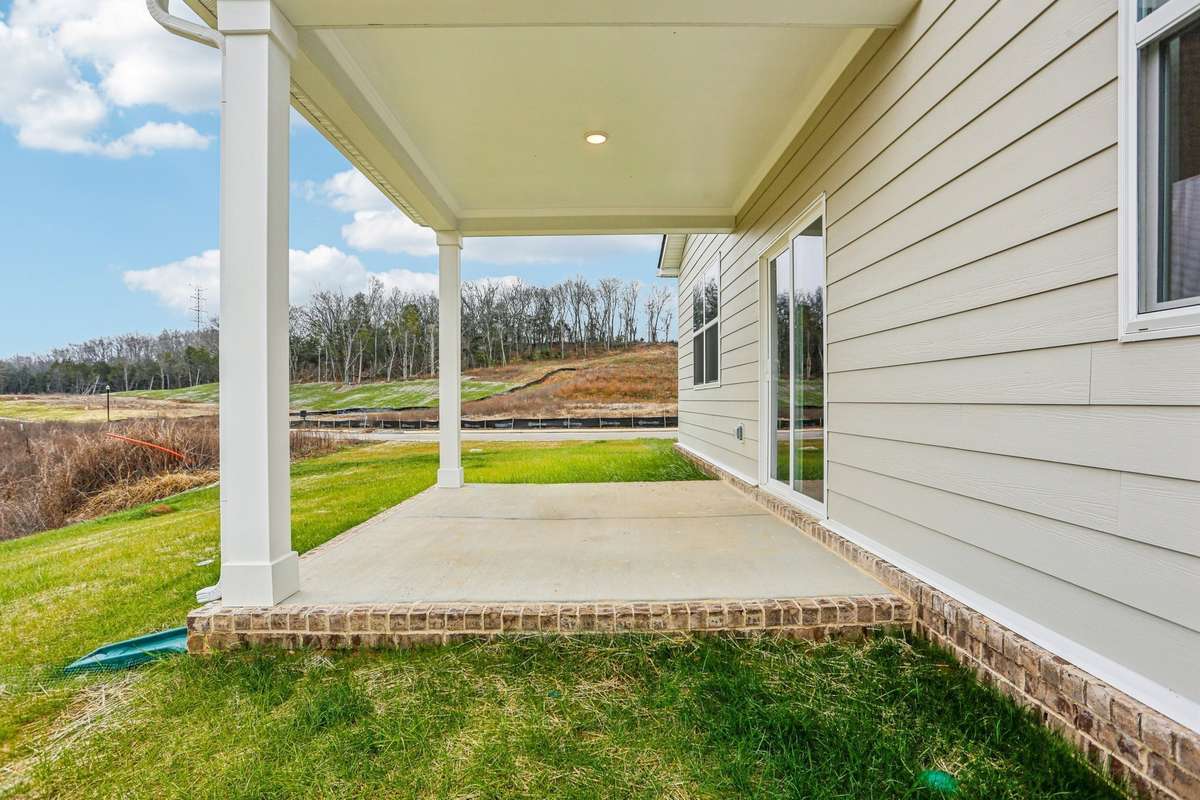The covered patio offers a comfortable, shaded retreat during the Tennessee summers.