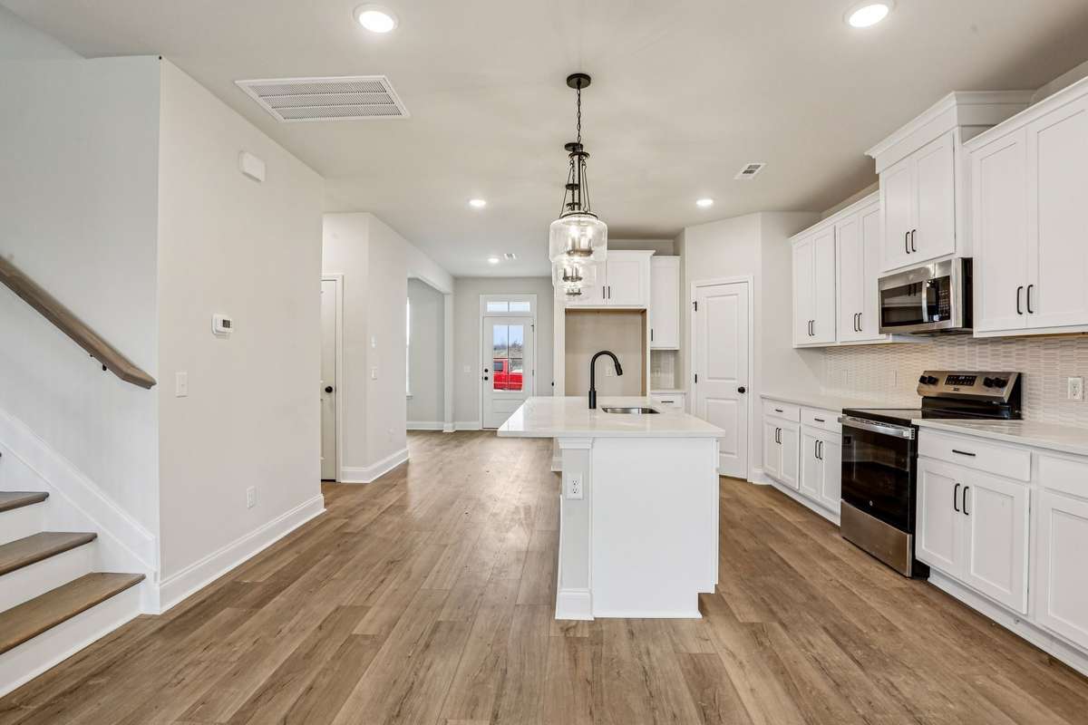 Stainless-steel appliances including a dishwasher, microwave, electric range are included with this home.