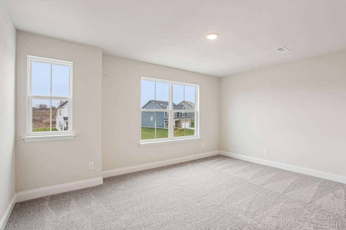 Bedroom #3 includes three large windows to let plenty of natural light in.