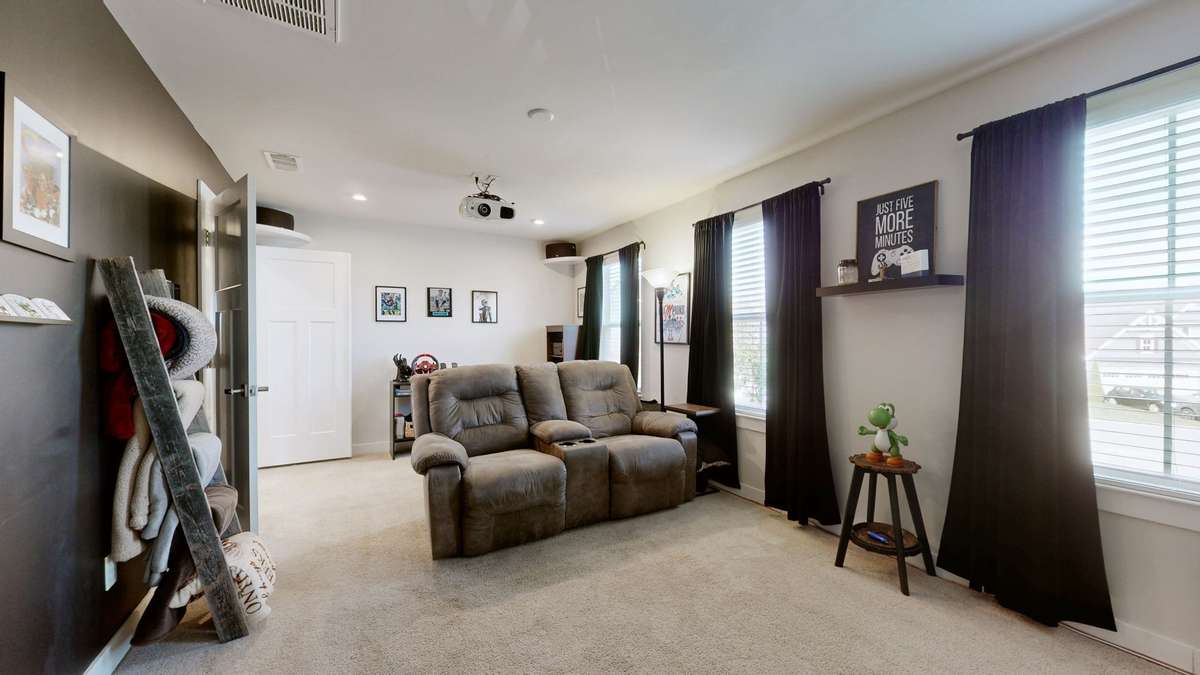 Spacious upper-level bonus room ideal for media or play