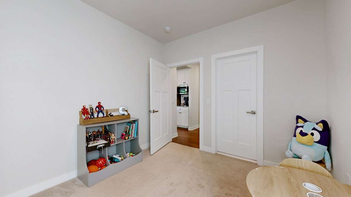 Main level guest suite with mobility friendly design features - wider doors and low threshold shower