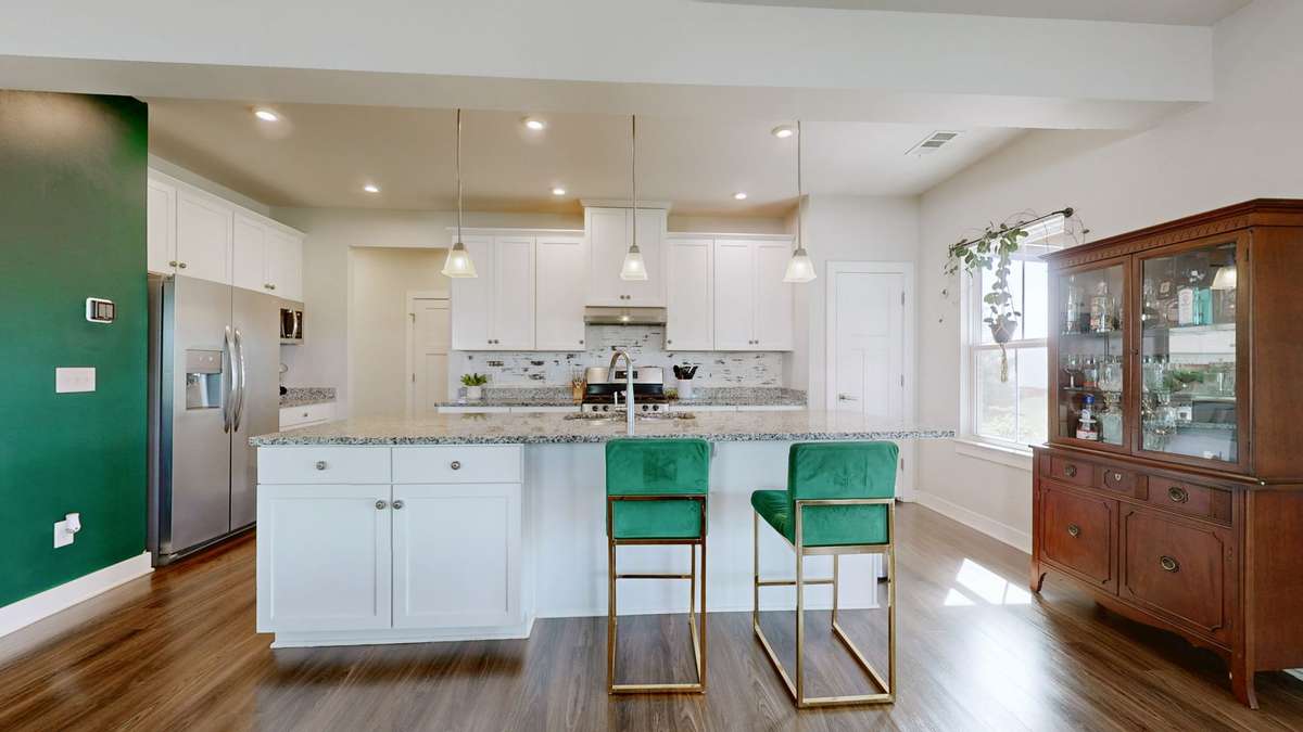 Bright kitchen with large island & abundant cabinetry
