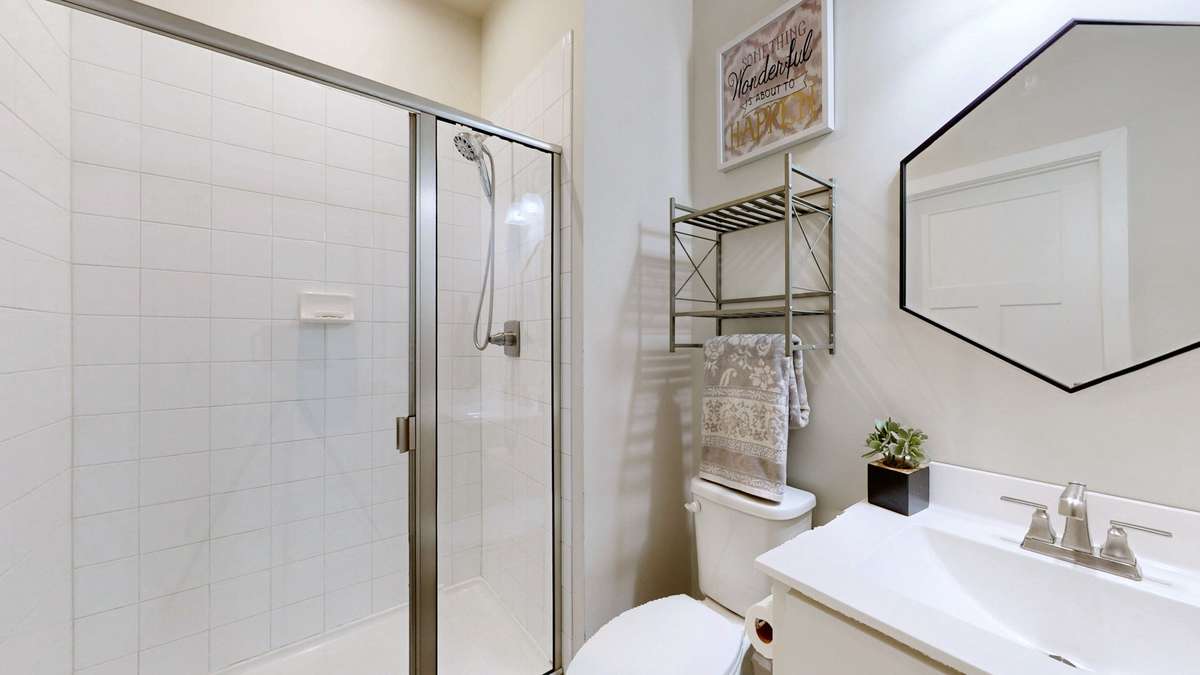 Full guest bathroom on main level with low-threshold walk in shower