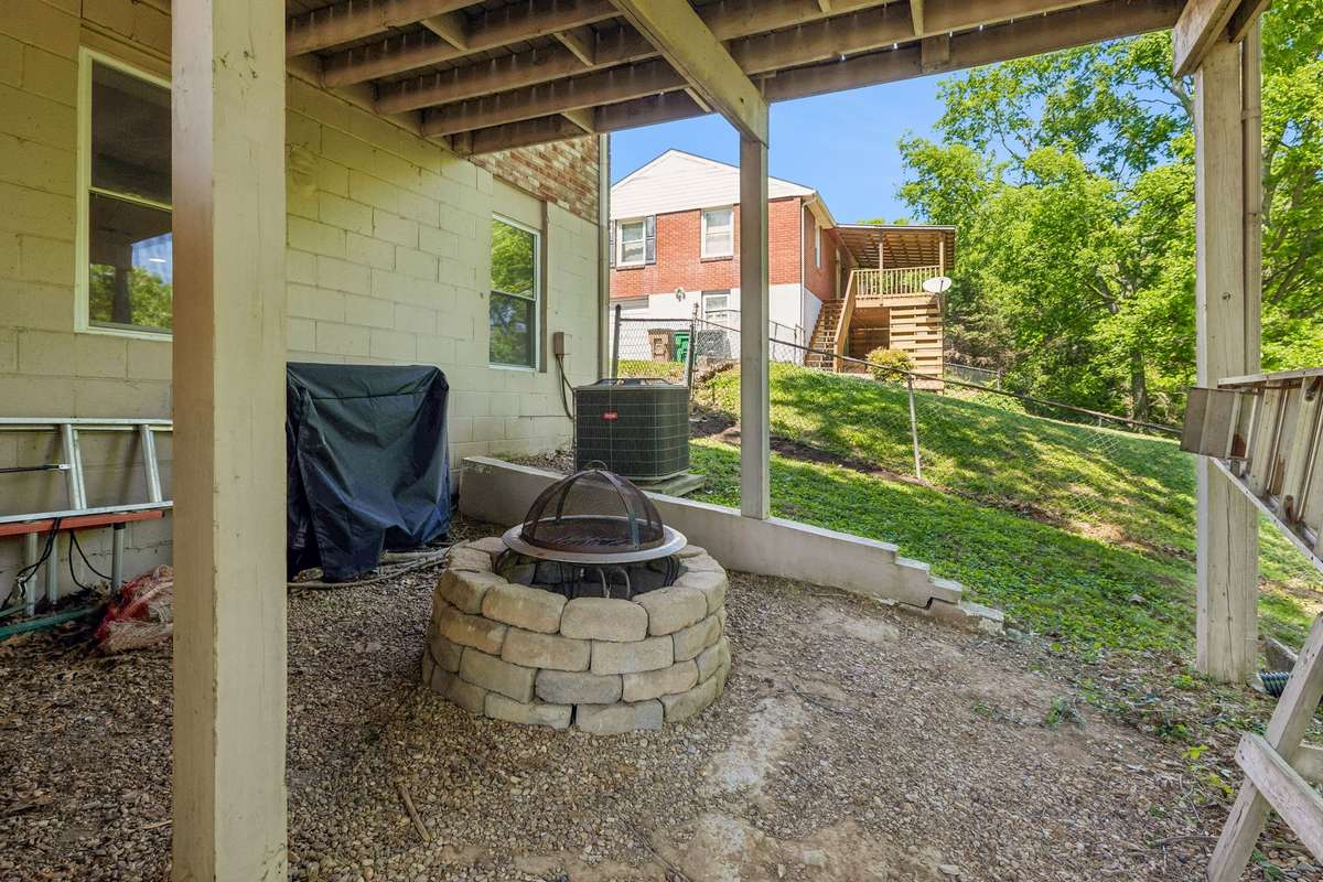 Additional outdoor living space beneath the deck with a fire pit—perfect for relaxing evenings and gatherings.