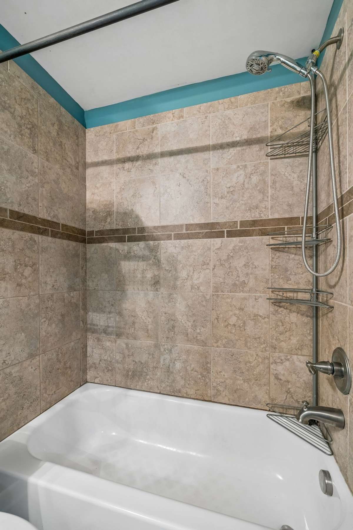 Full bathroom in the basement, conveniently located with the lower-level primary suite.