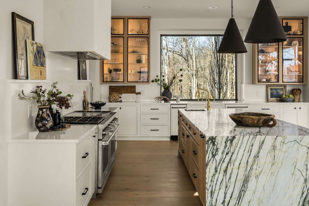 Professional-grade gas range anchoring the kitchen, designed for performance, precision, and elevated everyday cooking.