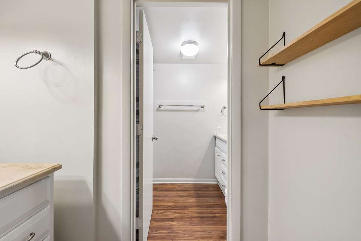 Primary bathroom with LVP flooring and separate, laminate 4 door vanities! 101 Cedarwood Lane, Madison, TN 37115