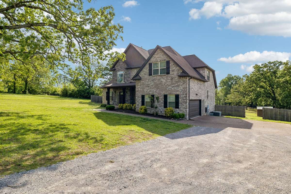 2015 Fleming Home All Brick on 5.2 Acres Fenced In and ready for your Mini Farm.