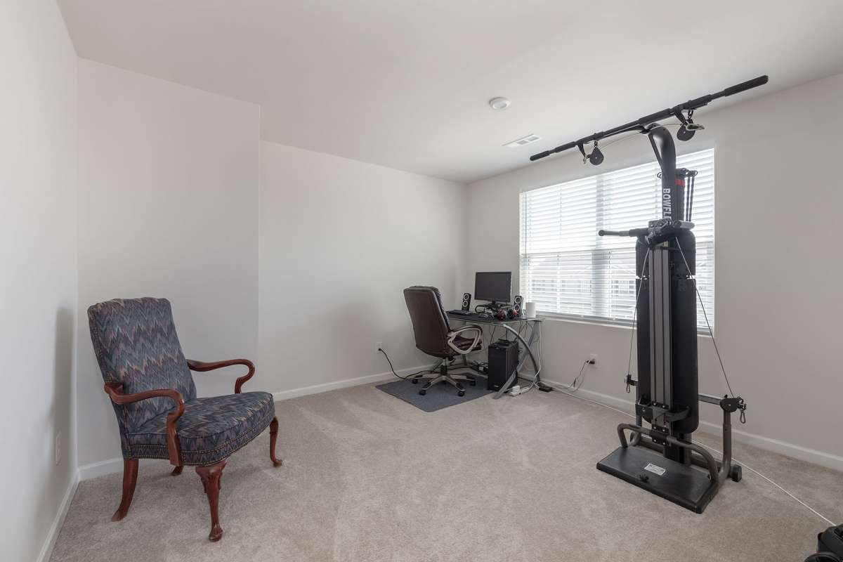 Third guest bedroom featuring walk in closet