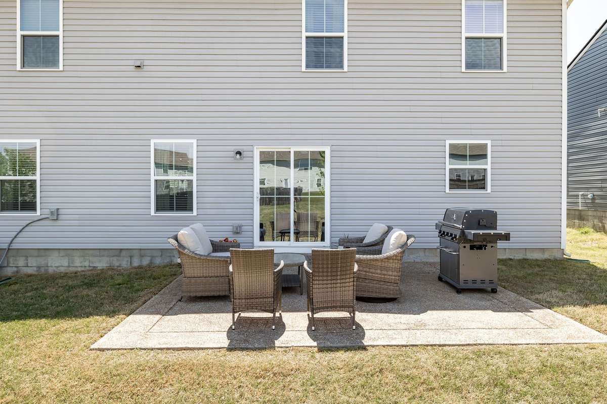 Patio upgrade! Sellers extended existing patio for room for grill and outdoor living!