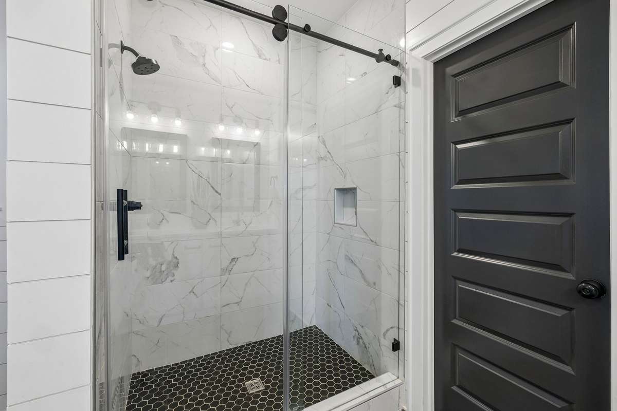 Extended shower with floor to ceiling tile