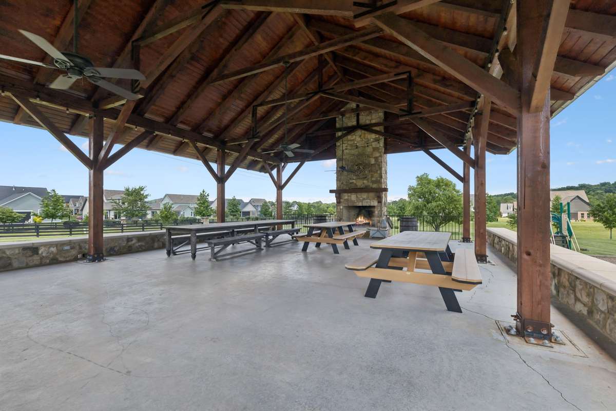 Community pavilion with fireplace for hosting or enjoying a meal outdoors