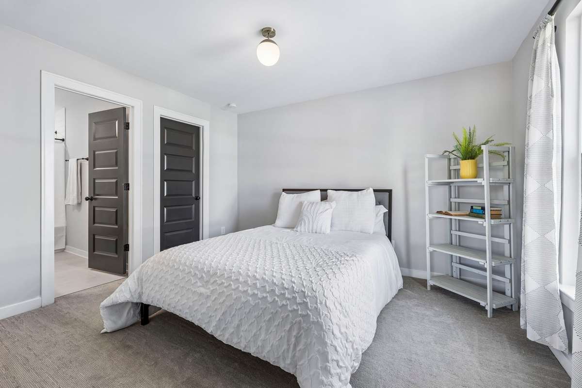One of three generously sized bedrooms upstairs, all with their own bathroom