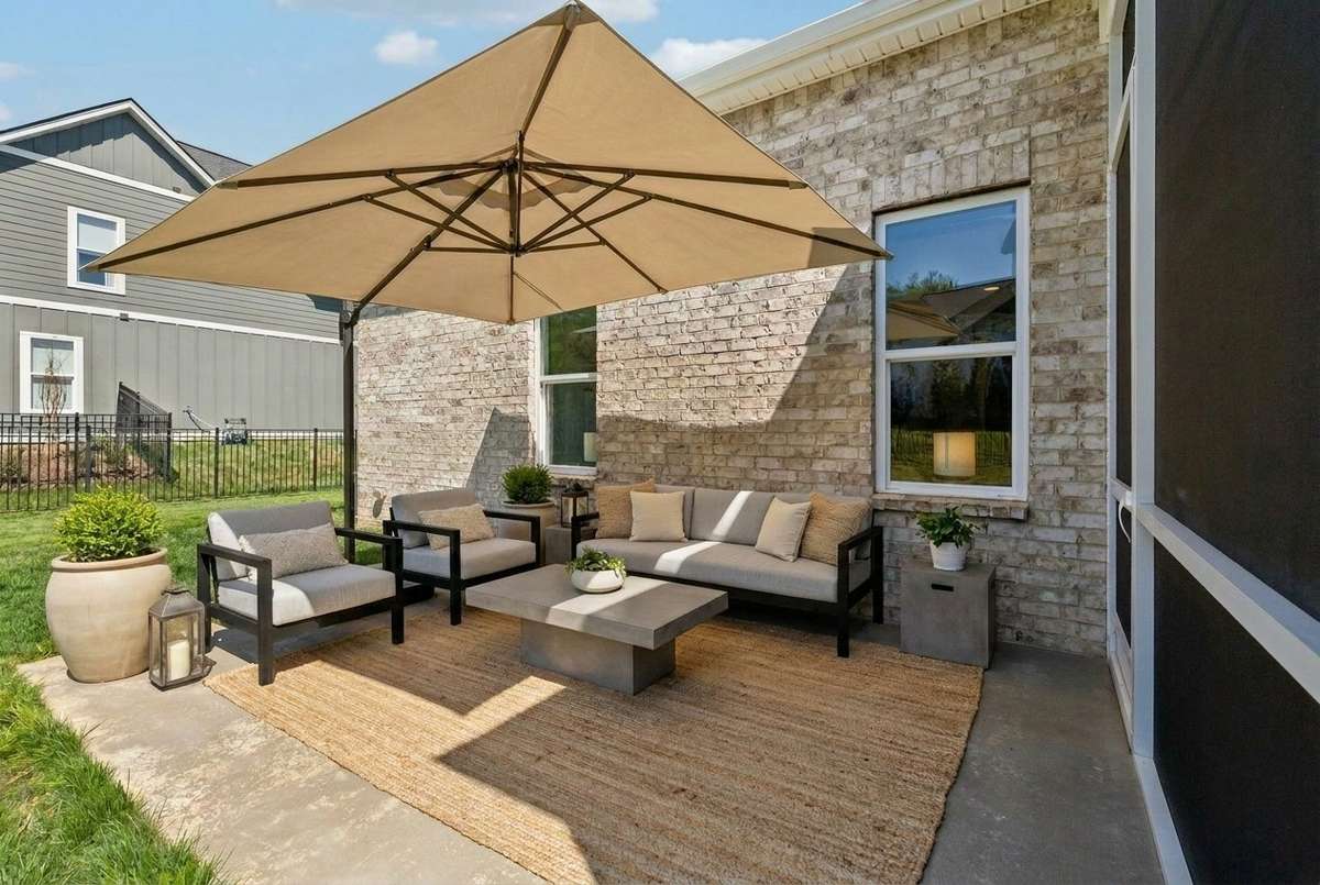 Additional back patio area is the perfect spot for a fire pit or grill *virtually staged