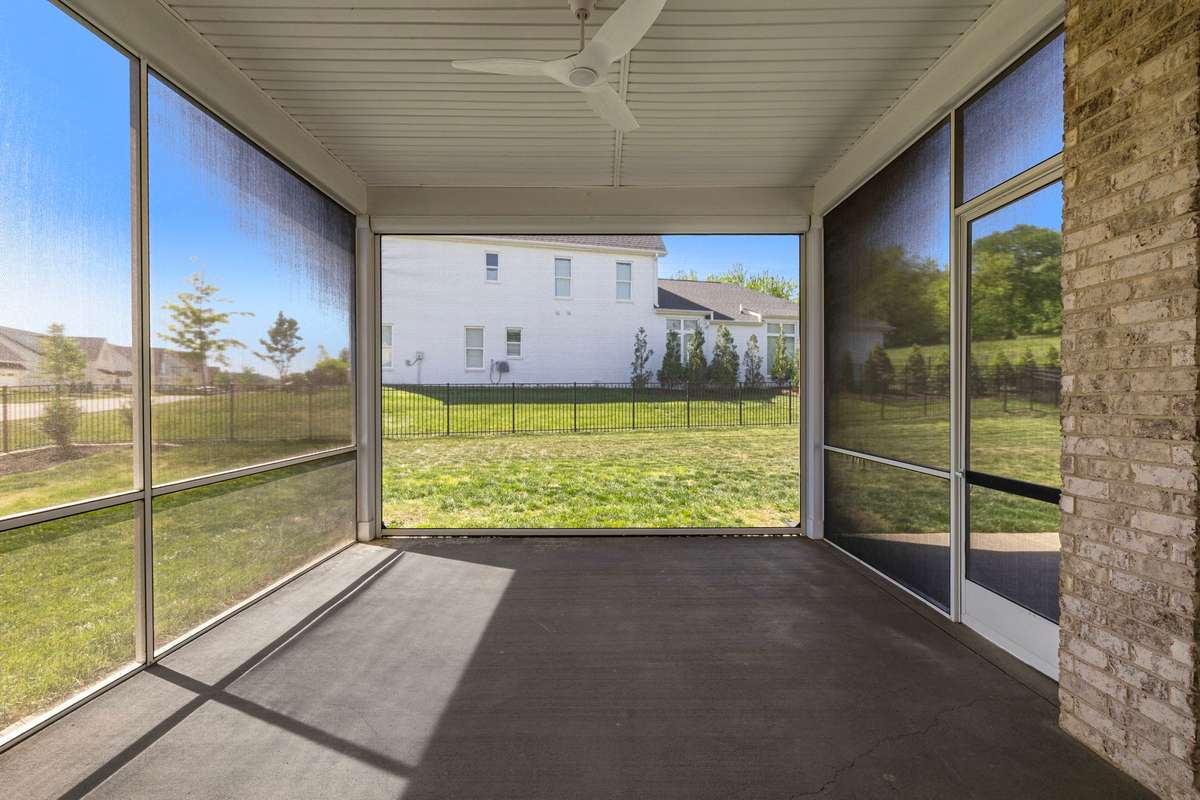 Extended covered patio features a convenient and sleek retractable screen