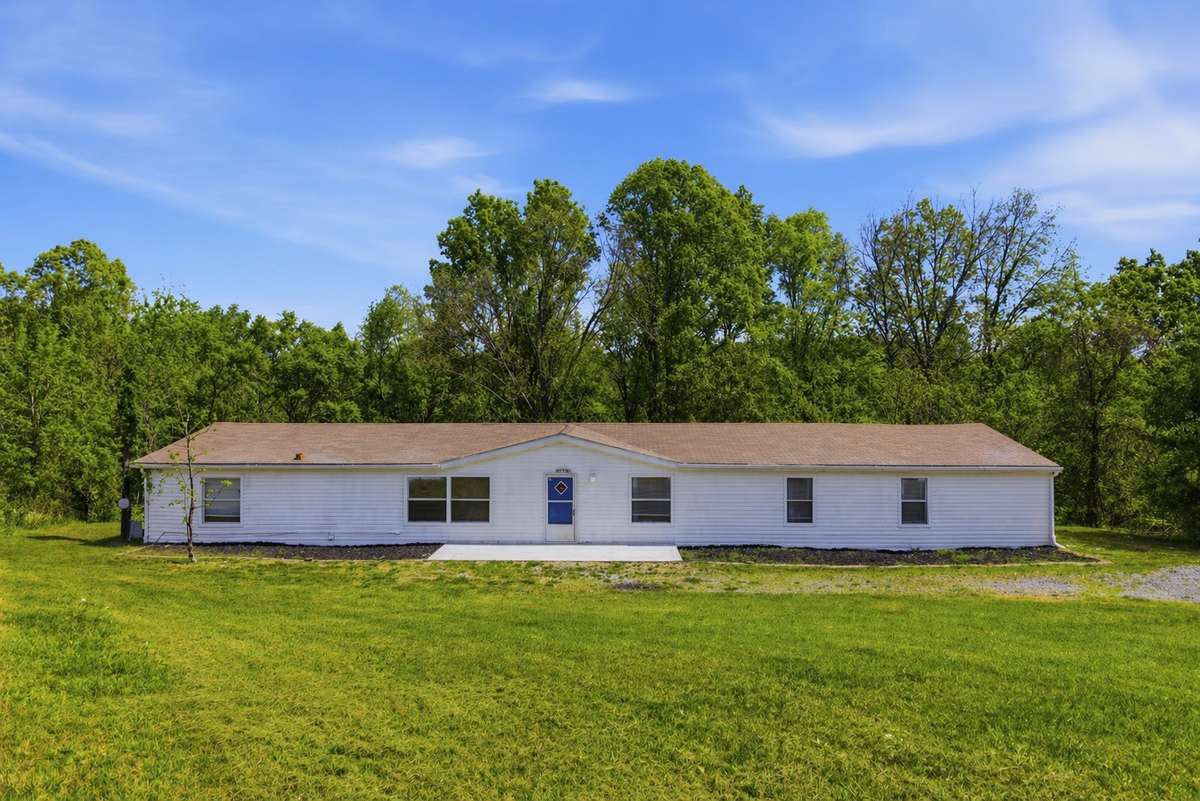 Spacious 4 bedroom home on 2.3 acres featuring a tranquil creek along the rear boundary