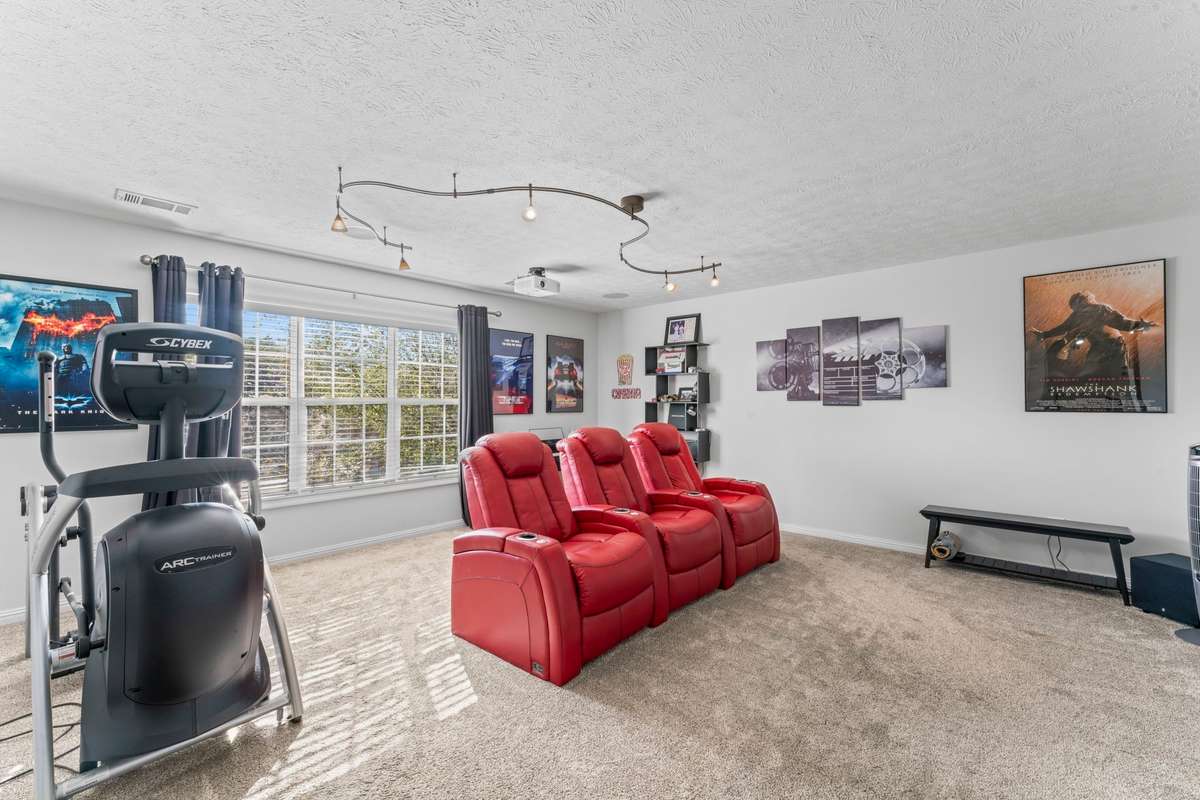 The bonus room comes with the project, screen, and theatre chairs!