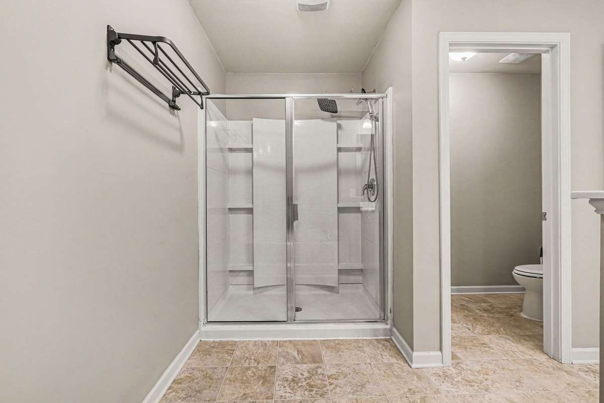 Primary bath has garden tub and separate shower