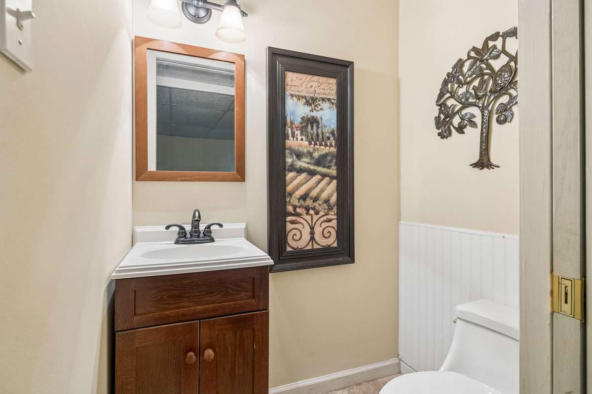 Half bath in the basement off of the rec room and hobby room.