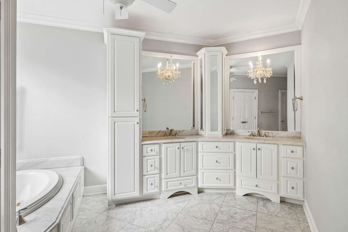 The primary bath has a separate tub and shower and includes a private laundry.