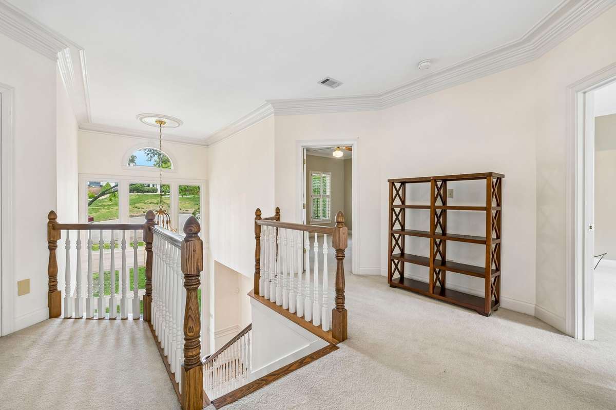 The second floor has four additional bedrooms and a laundry room