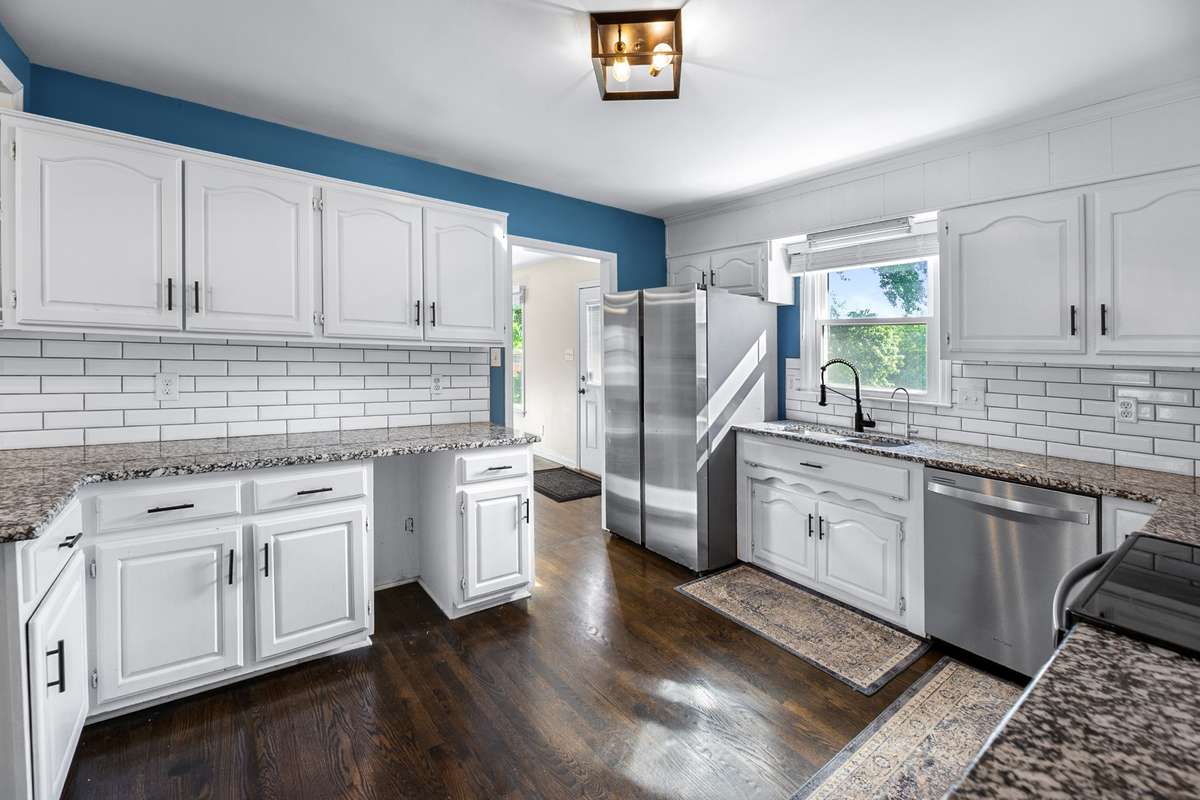 Kitchen facing back of home