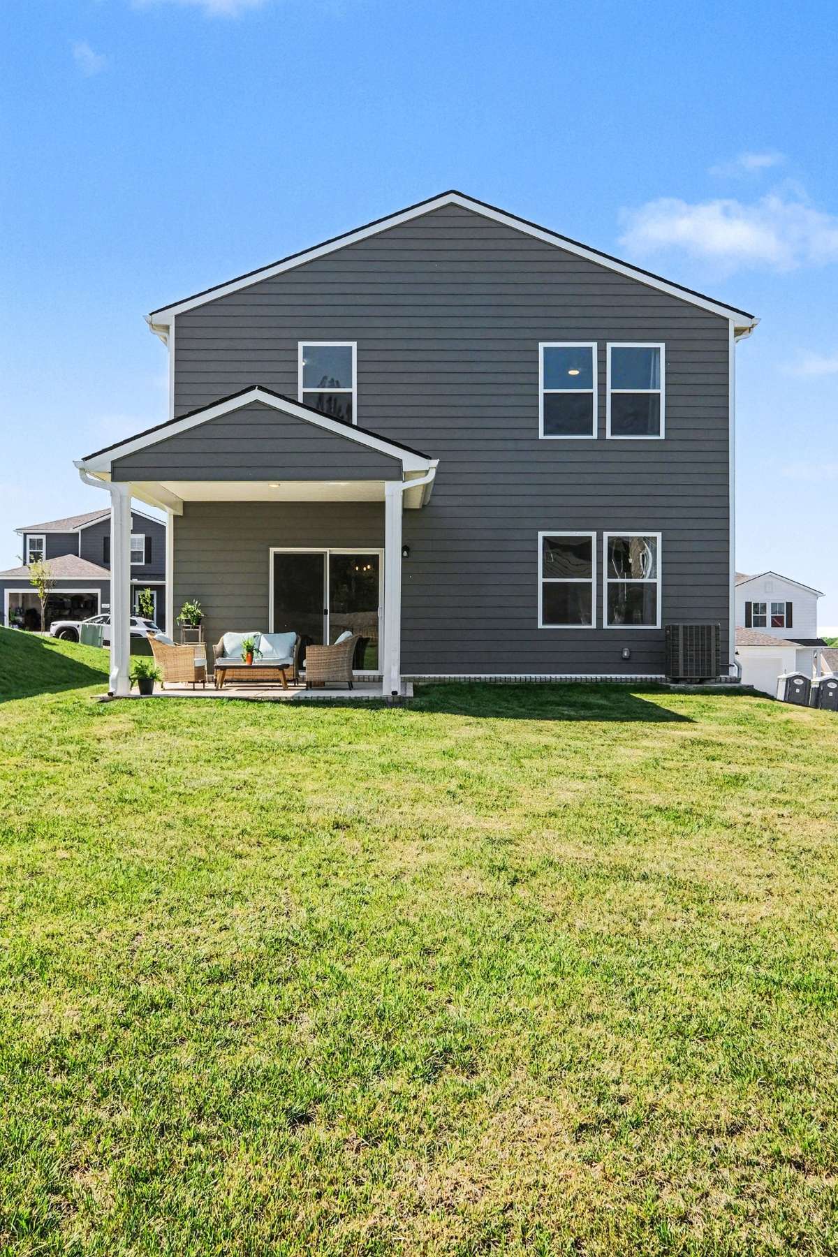 This yard is large and flat, ready for your new fence. The house color is a really nice hunter green.