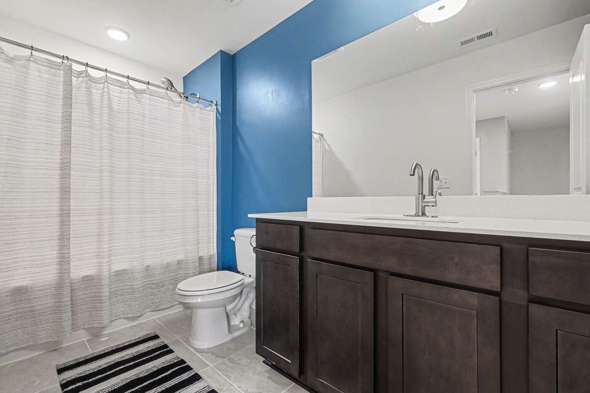 Bathroom for the 2 additional bedrooms upstairs, with a new light and new faucets