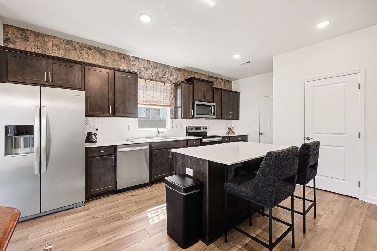 The garage entrance leads right into the kitchen, there is also a very large closet off the kitchen that extends all the way under the stairs.