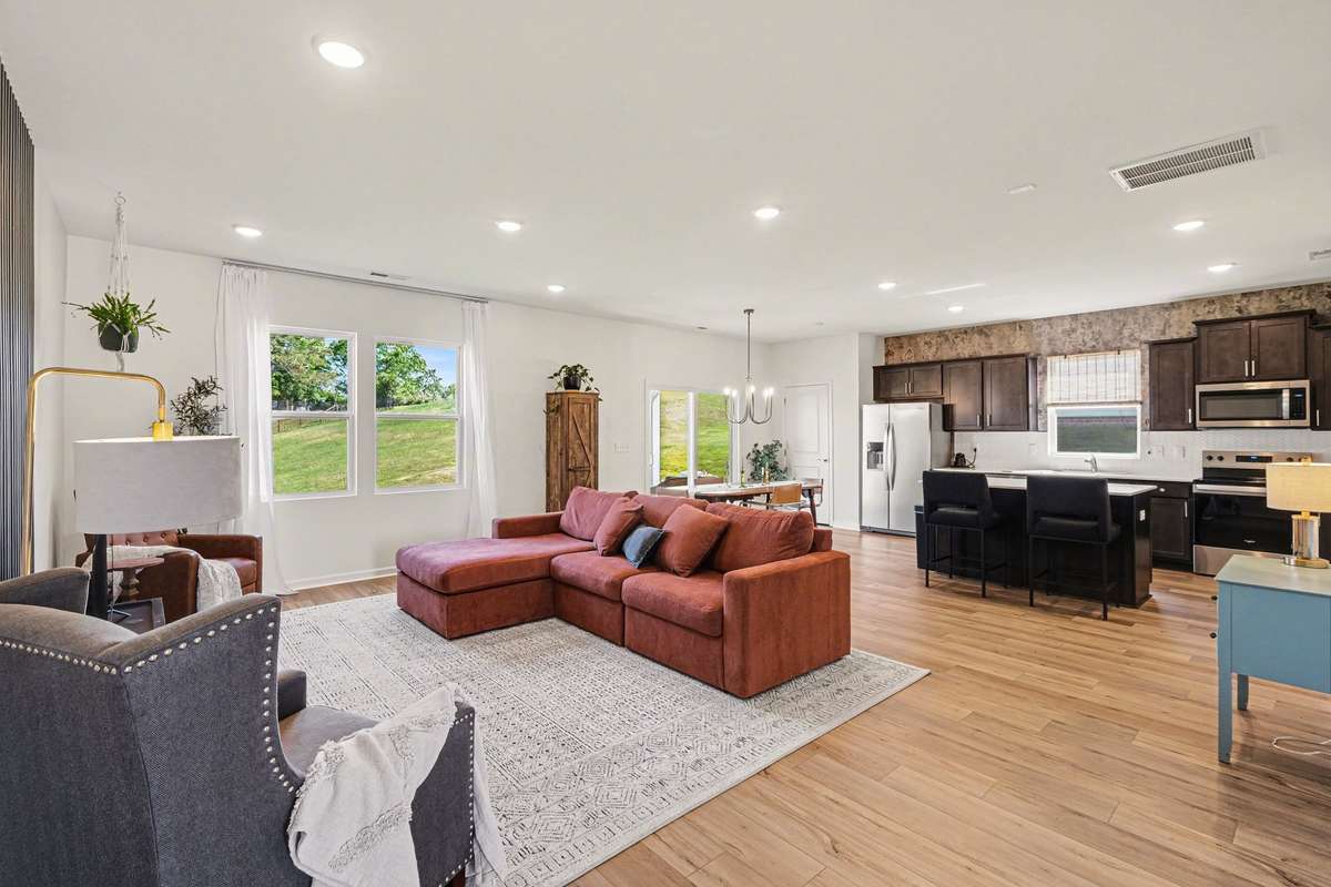 After passing the foyer you'll enter the large open living, dining and kitchen.