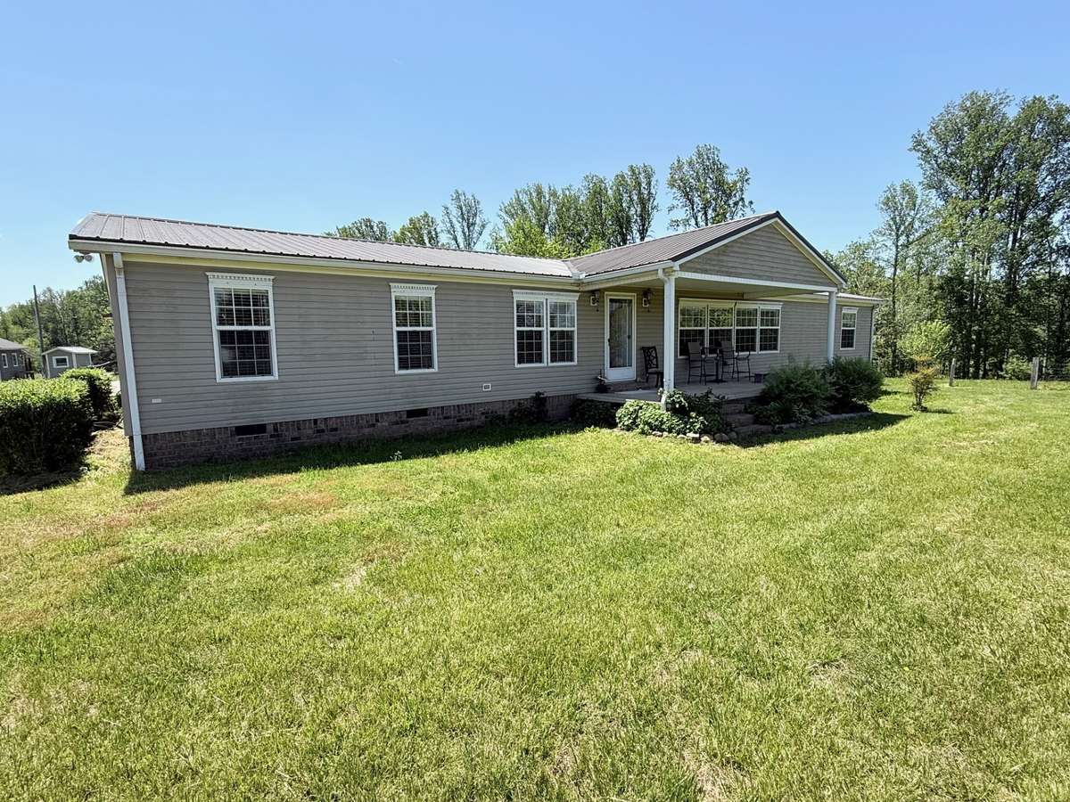 Large front yard with mature landscaping